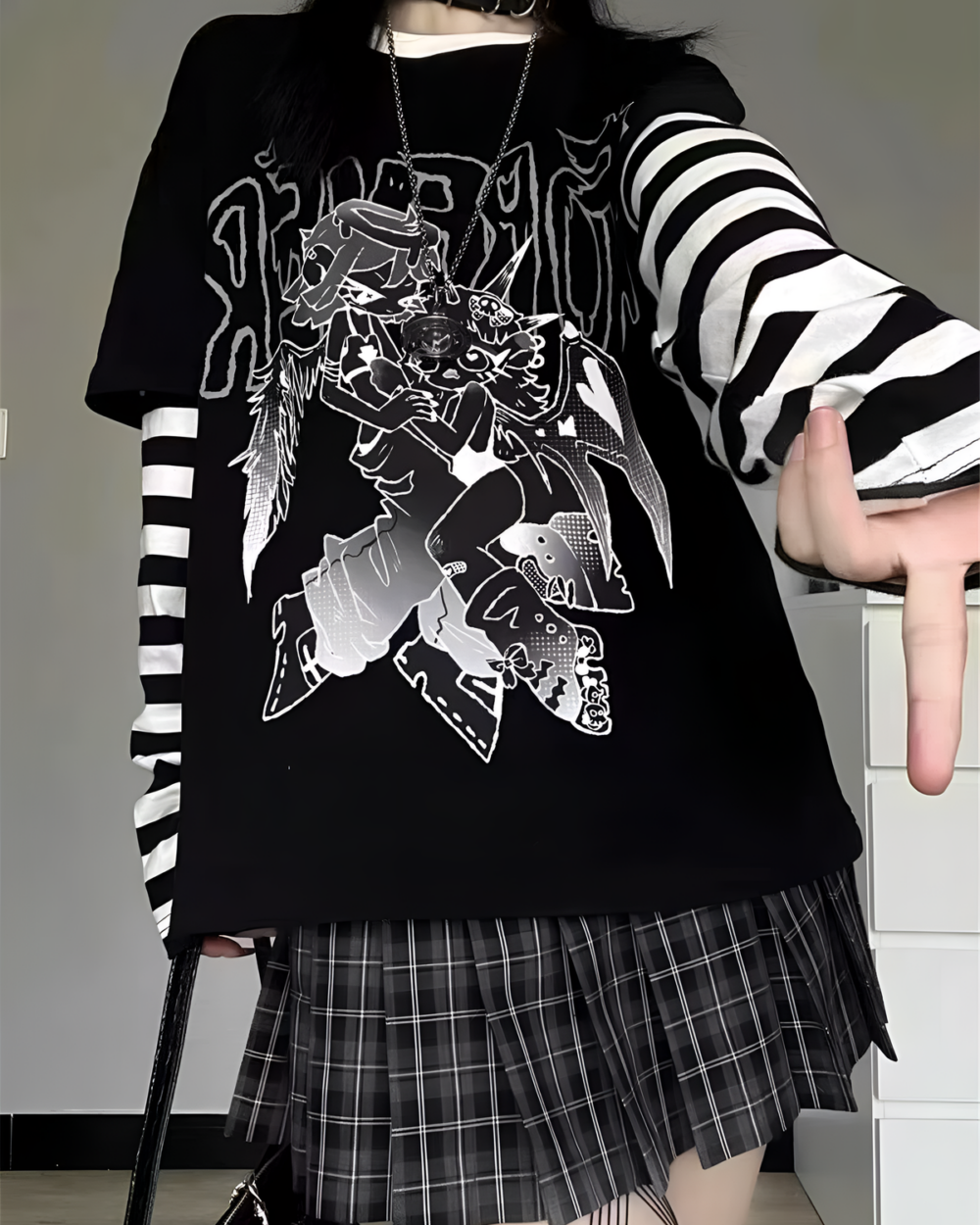 Black Animecore Aesthetic Tee with a graphic featuring cartoon creatures and striped sleeves.