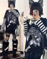 Close-up of a model wearing an Animecore Aesthetic Tee featuring black and white stripes.