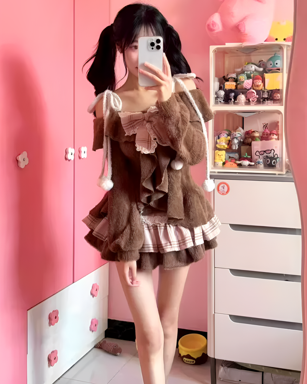 Woman wearing a Sweet Lolita Set, brown layered dress with lace details, pink room background.