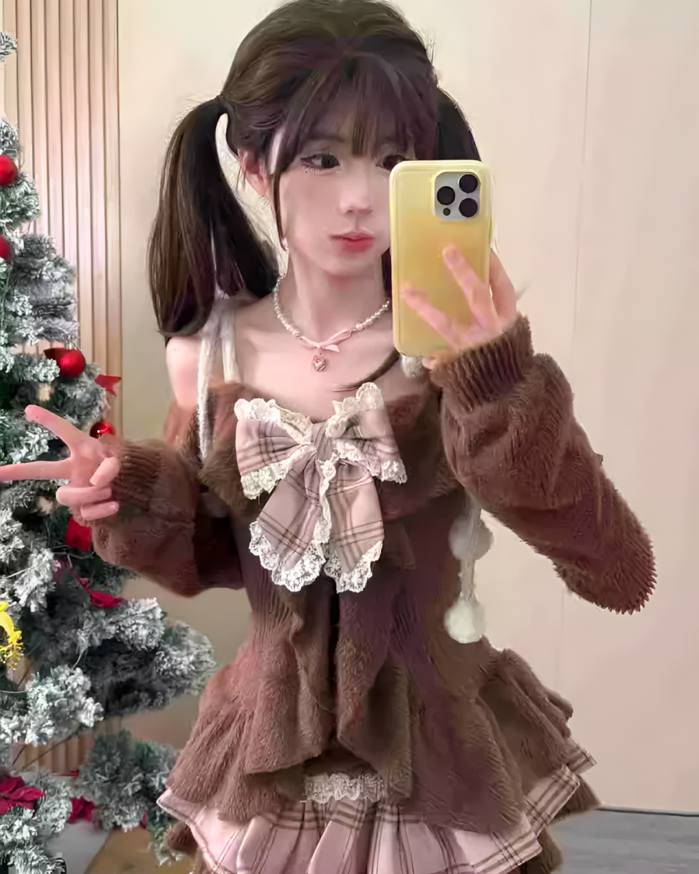 Model wearing a Sweet Lolita Set, featuring a brown sweater and plaid skirt.