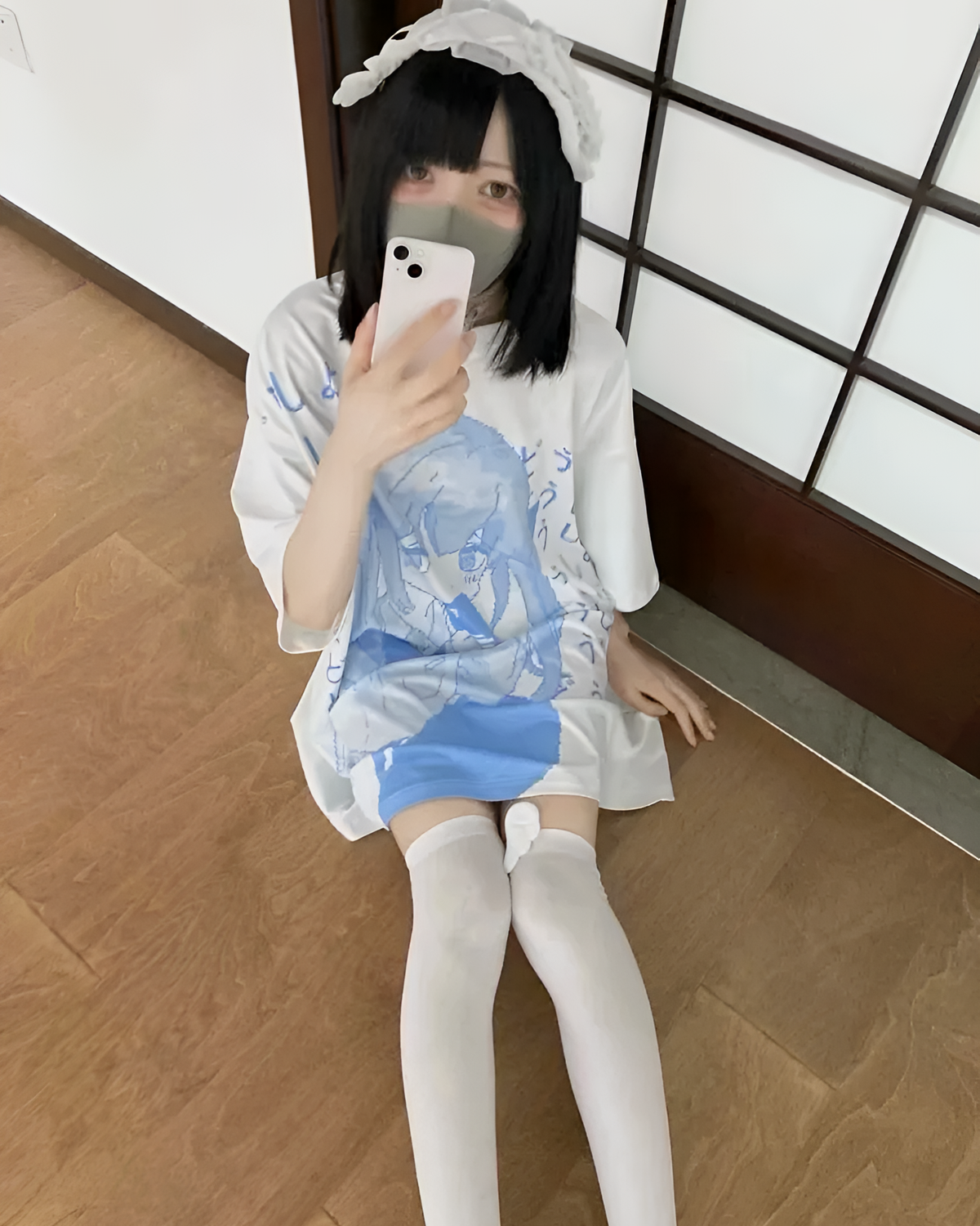 White loose Animecore Aesthetic Tee featuring a blue anime-style print, worn by a person.