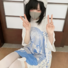 Model wearing a White Loose T-Shirt - Animecore Aesthetic. Blue graphic print, headband, and mask.