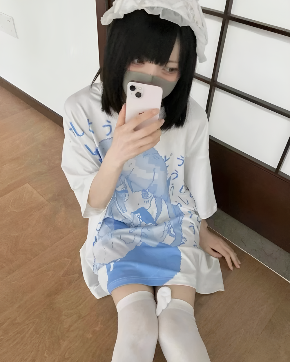 White loose Animecore Aesthetic Tee with blue watercolor print and phone.