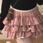 Pink ruffled mini skirt with bows, showcasing the Yume Kawaii Aesthetic.
