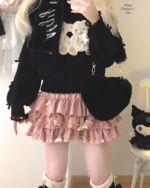 Yume Kawaii Aesthetic ruffled mini skirt with cat appliqué and layered ruffles.