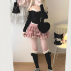 Yume Kawaii Aesthetic ruffled mini skirt styled with a black sweater, thigh-high socks, and platform shoes.
