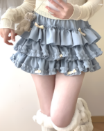 Light blue Yume Kawaii Aesthetic ruffled mini skirt, featuring multiple layers of ruffles and bow accents.
