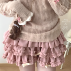 Pink ruffled mini skirt, Yume Kawaii Aesthetic. Layered ruffles and bows on a pink skirt.