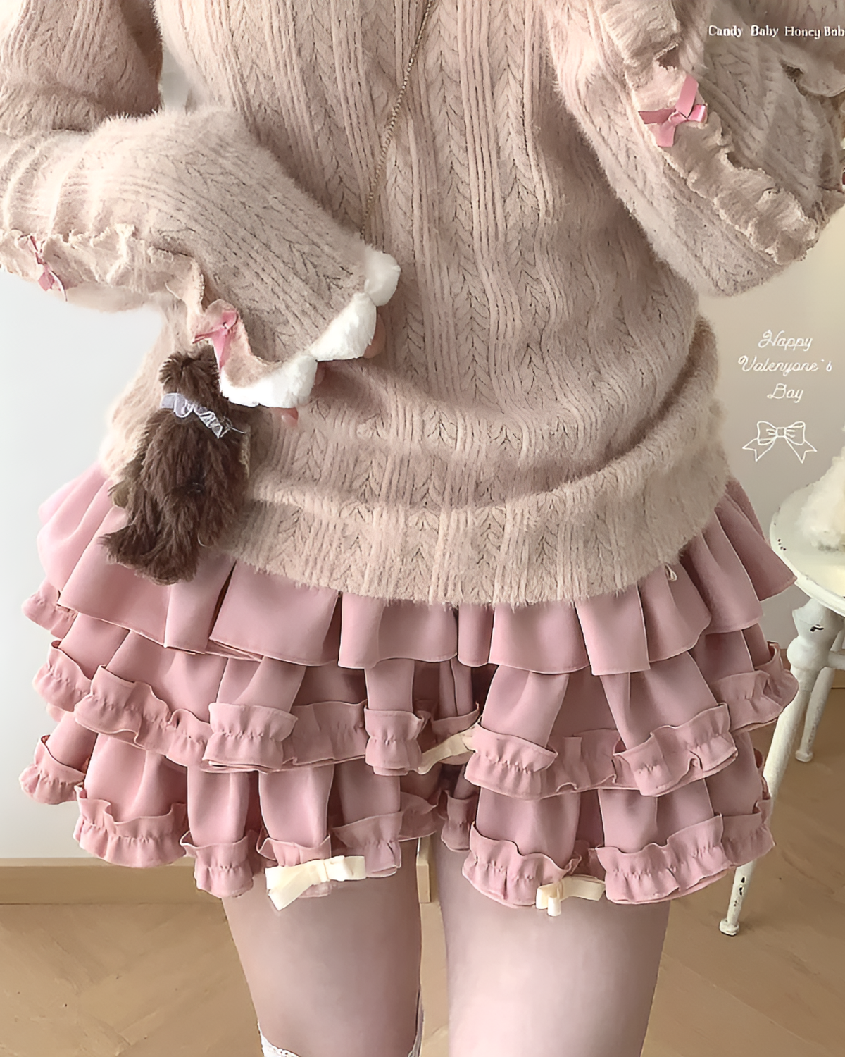 Pink ruffled mini skirt, Yume Kawaii Aesthetic. Layered ruffles and bows on a pink skirt.
