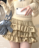 Yume Kawaii Aesthetic ruffled mini skirt in beige, featuring multiple layers and ruffles.