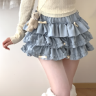 Light blue ruffled mini skirt, a Yume Kawaii Aesthetic, featuring multiple layers and a ribbon detail.