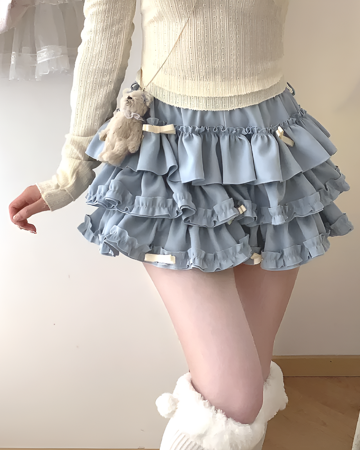 Light blue ruffled mini skirt, a Yume Kawaii Aesthetic, featuring multiple layers and a ribbon detail.