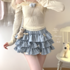 Yume Kawaii Aesthetic ruffled mini skirt paired with a cream sweater. Layered, ruffles detail.