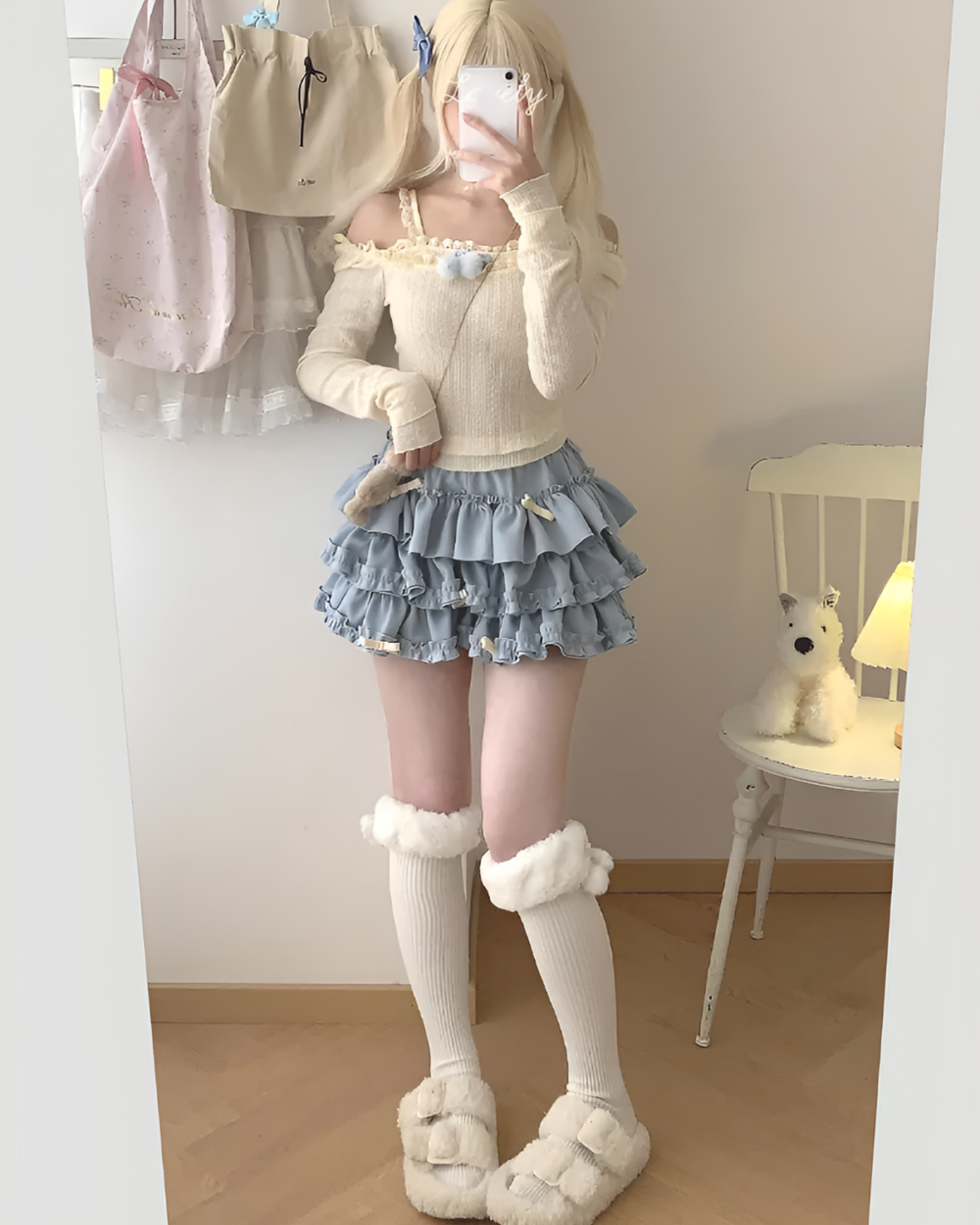 Yume Kawaii Aesthetic mini skirt with ruffles, worn with a long-sleeved sweater and fluffy socks.