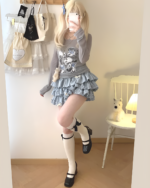 Yume Kawaii Aesthetic ruffled mini skirt, light blue, layered with a long-sleeved shirt and socks.