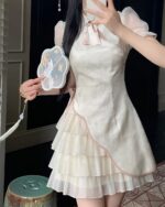 A layered Qi Lolita Dress in a floral print, featuring puff sleeves and a ruffled skirt.