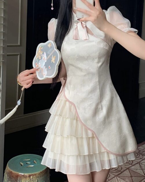 A layered Qi Lolita Dress in a floral print, featuring puff sleeves and a ruffled skirt.