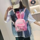 Pink Rabbit Ears Plush Backpack worn as a casual bag.