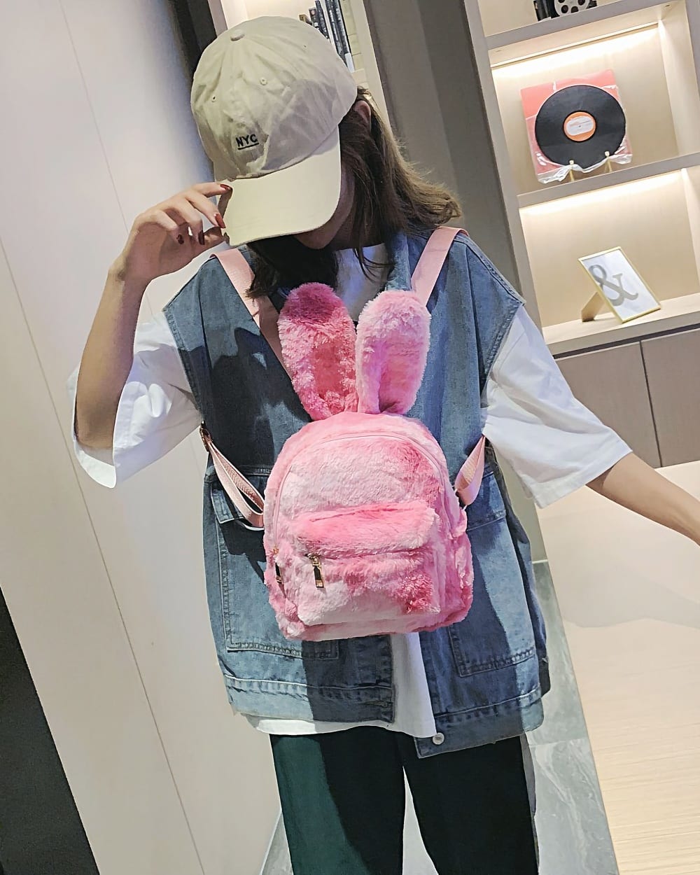 Pink Rabbit Ears Plush Backpack worn as a casual bag.