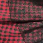 Close-up of Grunge Plaid Skirt fabric with red and black plaid pattern.