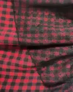 Close-up of Grunge Plaid Skirt fabric with red and black plaid pattern.