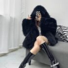 Black Thick Fluffy Faux Fur Coat draped over a chair.