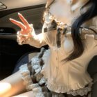 Ruffled Brows Skirt and Top - Coquette aesthetic outfit details: lace trim, ruffled sleeves, and plaid skirt.