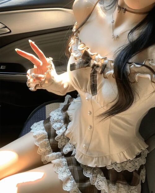 Ruffled Brows Skirt and Top - Coquette aesthetic outfit details: lace trim, ruffled sleeves, and plaid skirt.