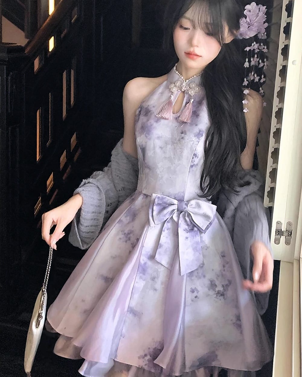 A light purple Qi Lolita Dress with a bow, featuring a floral print and lace detailing.