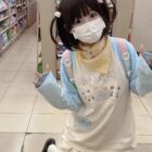Model wearing a Kawaii Panda Pastel Long Sleeve T-Shirt - Jojifuku Aesthetic in a store.