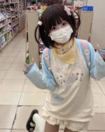 Model wearing a Kawaii Panda Pastel Long Sleeve T-Shirt - Jojifuku Aesthetic in a store.