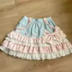 Lolita Skirt Top Set featuring a layered, ruffled skirt and blue top with 'cute kittens' embroidery.
