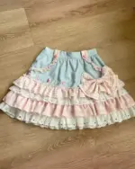 Lolita Skirt Top Set featuring a layered, ruffled skirt and blue top with 'cute kittens' embroidery.