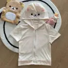 Kuma Zip Up Hoodie - Jojifuku Hoodie displayed with plush toys on a rug.