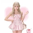 Model wearing a pink Coquette Aesthetic Dress with lace detailing and bows.