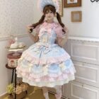 A woman wearing a Frilly Ribbon Dress - Hime Lolita Dress, featuring layers and a pink and blue color scheme.