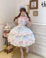 A woman wearing a Frilly Ribbon Dress - Hime Lolita Dress, featuring layers and a pink and blue color scheme.