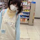 Person wearing a Kawaii Panda Pastel Long Sleeve T-Shirt in a store setting.