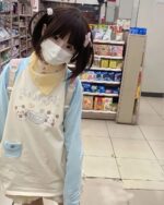 Person wearing a Kawaii Panda Pastel Long Sleeve T-Shirt in a store setting.