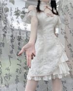 White lace Qi Lolita Dress with ruffled layers and a high collar.