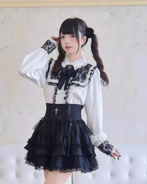 Dark Lolita Set: White blouse with lace details and black tiered skirt, featuring a corset belt.