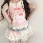 Lolita Skirt Top Set featuring a layered, ruffled design with cat motifs and delicate details.
