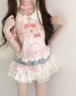 Lolita Skirt Top Set featuring a layered, ruffled design with cat motifs and delicate details.