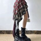 Patched plaid Grunge Aesthetic Skirt, featuring a layered, asymmetrical design and visible stitching.