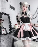 Black and pink Kawaii Maid Dress with frills, worn by a model. Cute cosplay outfit for girls and women.