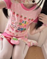 Pink Mezzo Piano Strawberry T-Shirt with strawberries, hearts, and cute animal designs.