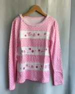 Mezzo Piano Shirt featuring a pink polka dot design with strawberry and heart motifs.