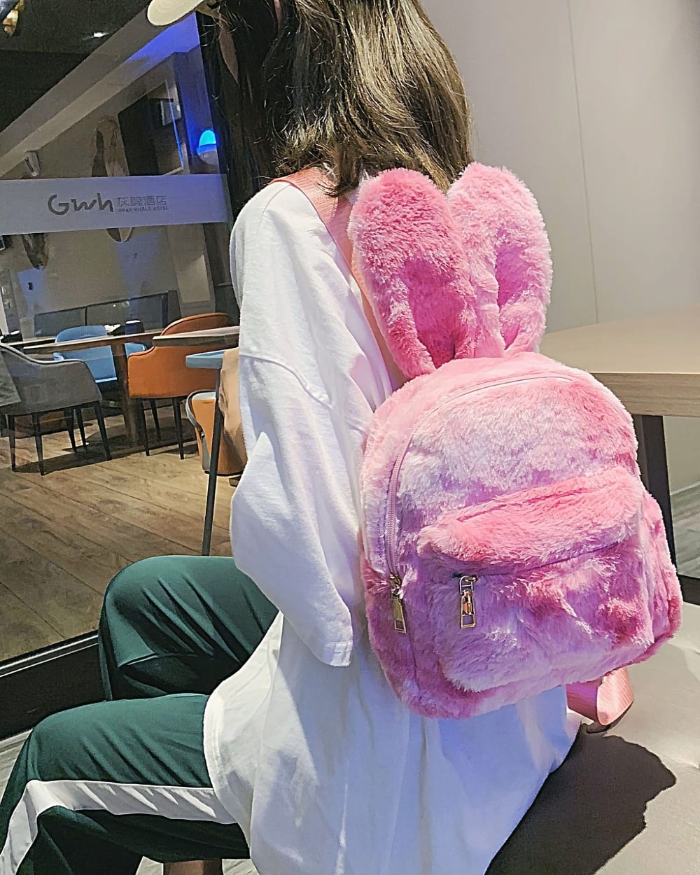 Pink Rabbit Ears Plush Backpack showcasing a soft, furry design and adjustable straps.