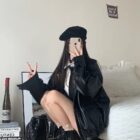 Person wearing a black Korean Style Jacket with beret and boots.