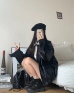 Person wearing a black Korean Style Jacket with beret and boots.